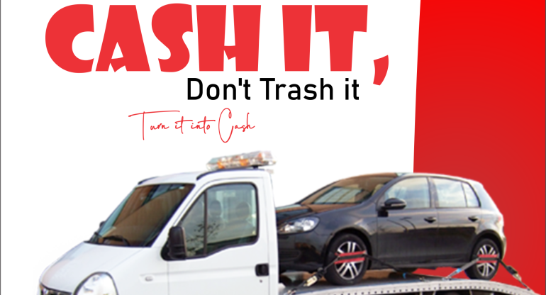 A junk car being loaded onto a tow truck for removal.